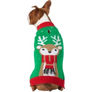 dog wearing a knitted sweater with a reindeer